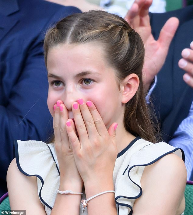 Charlotte took a leaf out of Kate's style book in a white frock with delicate frill detailing at the hem and black v-line stitching designed by the Givenchy designer