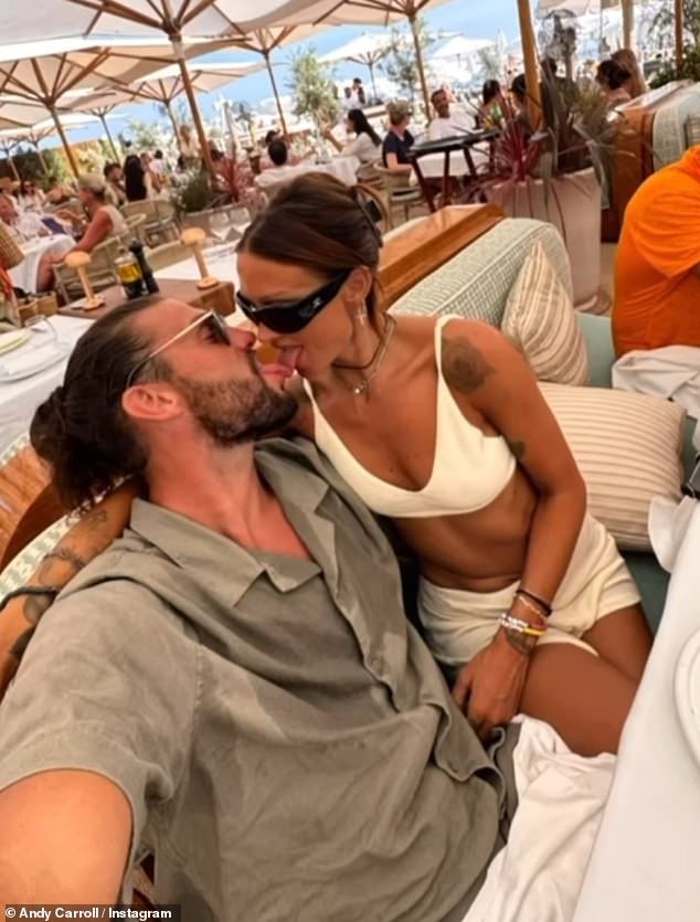 Andy Carroll couldn't keep his hands of girlfriend Lou Teasdale in a new loved-up Instagram montage showing off their romantic holiday on Wednesday