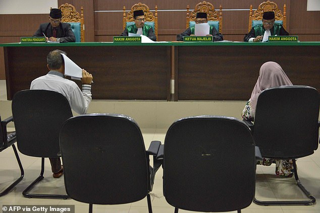 Outraged MPs demanded action last night as it emerged that a Government jobs site is advertising a role in a sharia court. Pictured: File photo of a sharia court in Banda Aceh, Indonesia