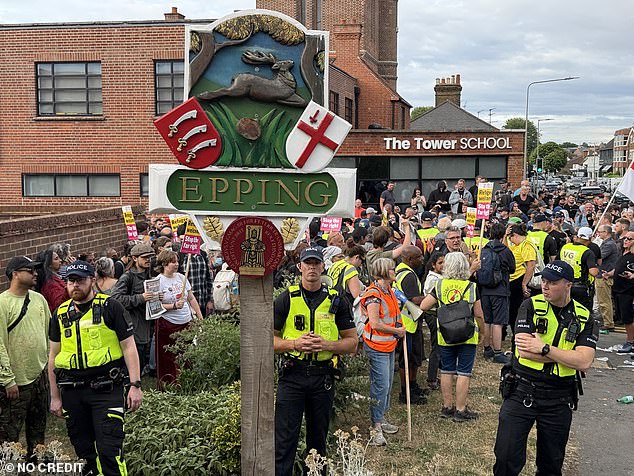 Essex Police were out in force in Epping tonight as hundreds of angry residents took to the streetsto voice their anger after an asylum seeker was charged with sexual offences