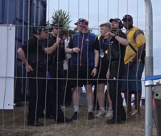 AngryGinge (centre) and two other streamers were arrested at Silverstone on Friday