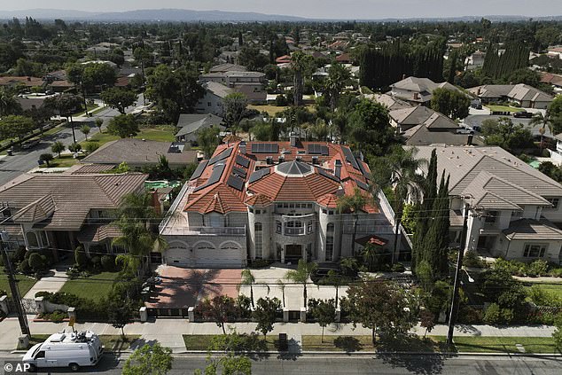 Neighbors said the couple's lavish mansion was set up 'like a hotel', with a lobby and nine bedrooms