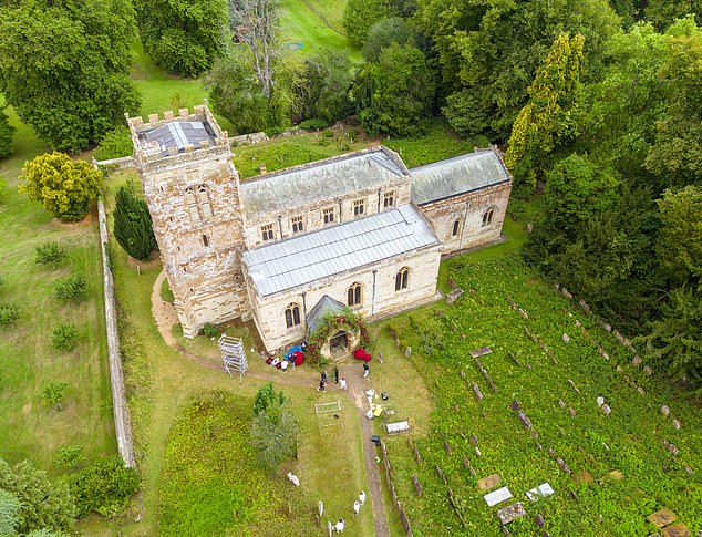 Eve walked through an impressive floral display erected around the vestibule of the church and she made her way through a garland of beech branches and red roses