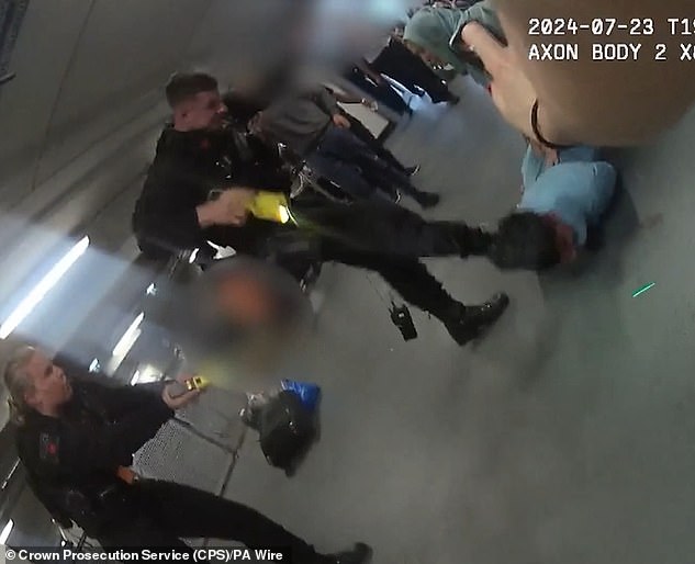 PC Zachary Marsden said he did not know his colleague PC Ellie Cook (left) had just Tasered headbutt suspect Mohammed Fahir Amaaz (in blue, lying on the ground) when he aimed a kick at his head