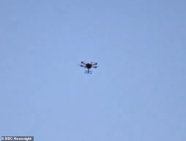 The video captured last June shows the aircraft (above) hovering above the category B men's prison
