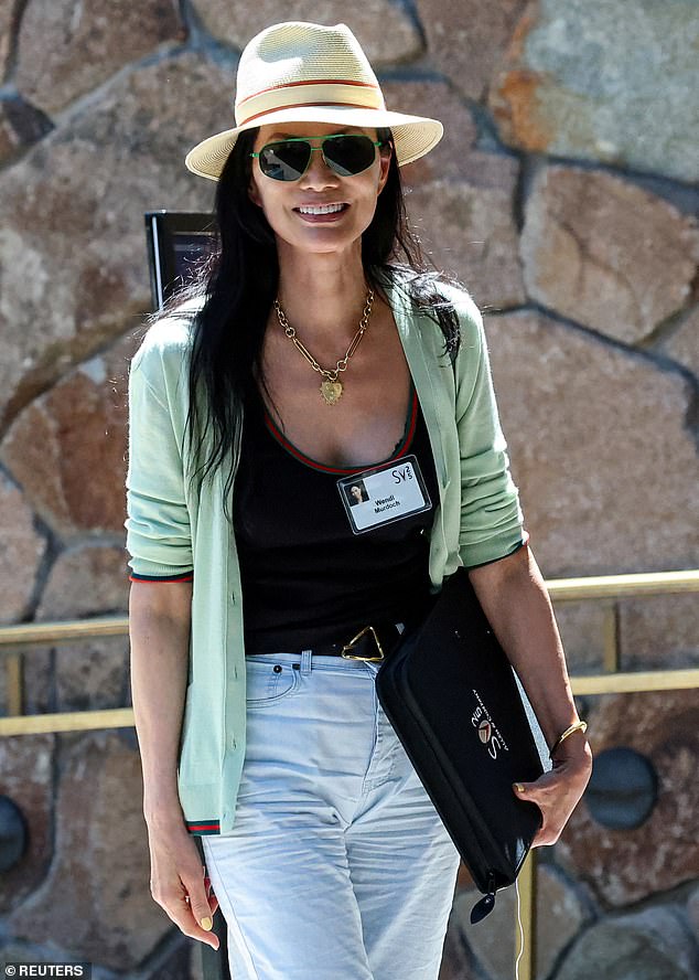 Matchy-matchy! Wendi Murdoch, 56, who was the third wife of media mogul Rupert Murdoch, showed up to Sun Valley in a matching Gucci outfit. She wore a black tank top with red detailing around the neck, paired with a mint green, v-neck cardigan with the same red tipping on the sleeve and hem. Wendi topped things off with a cream-colored fedora hat with the same signature Gucci red stripe around it, looking put-together for her first day at Sun Valley