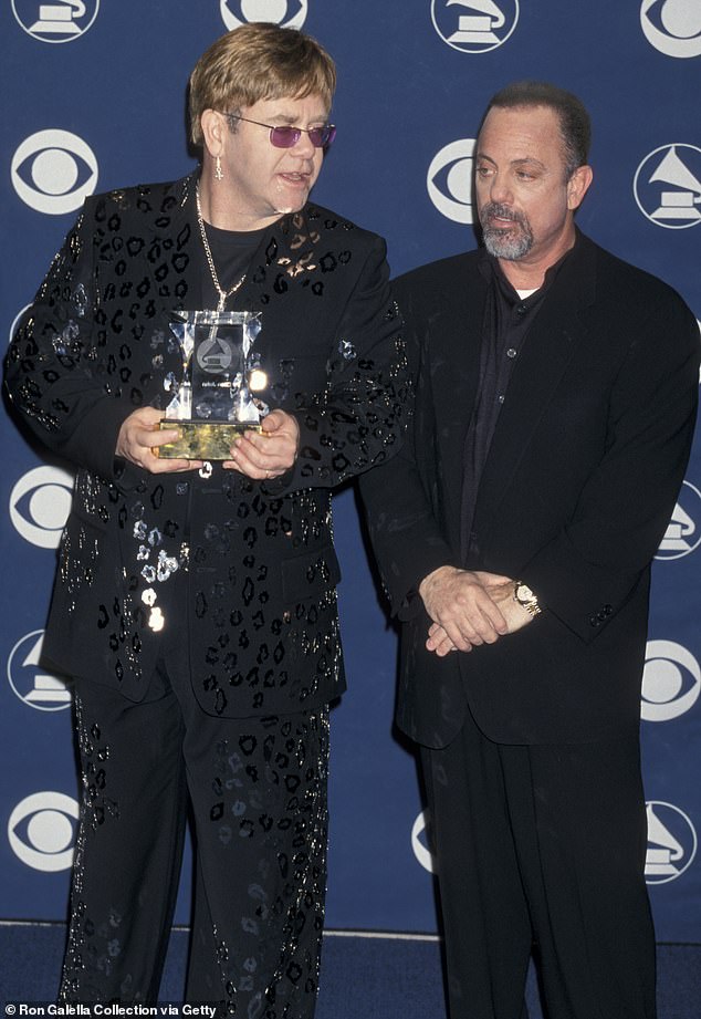 Billy Joel says he and old friend Elton John are in a good place now, but at one time there was 'bad blood' between the two; Pictured in Los Angeles in February 2000