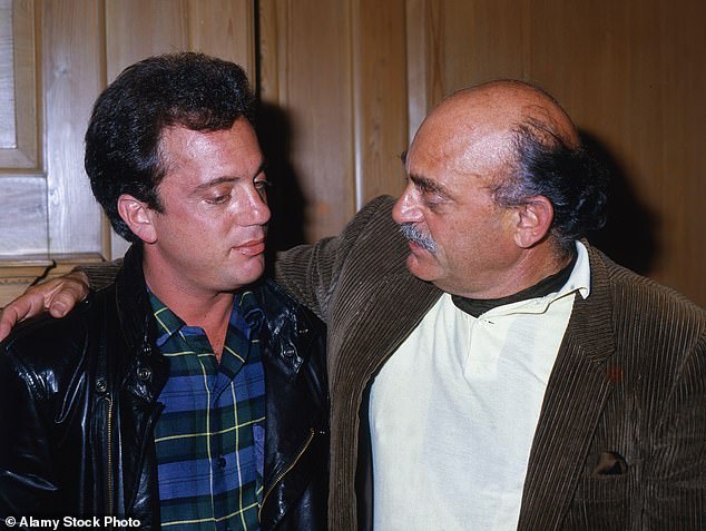 In the documentary, Joel recalls Howard ¿knocking me out¿ at age 8 over a piano mistake before eventually leaving the family for Europe, and says that even after they reconnected, searching for his father remained a driving force in his life; (Joel with father Howard Joel in 1986)