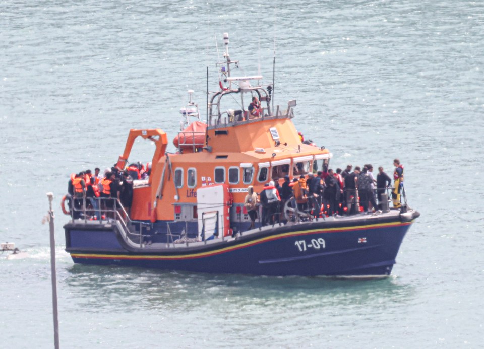 RNLI lifeboat bringing rescued migrants to Dover.