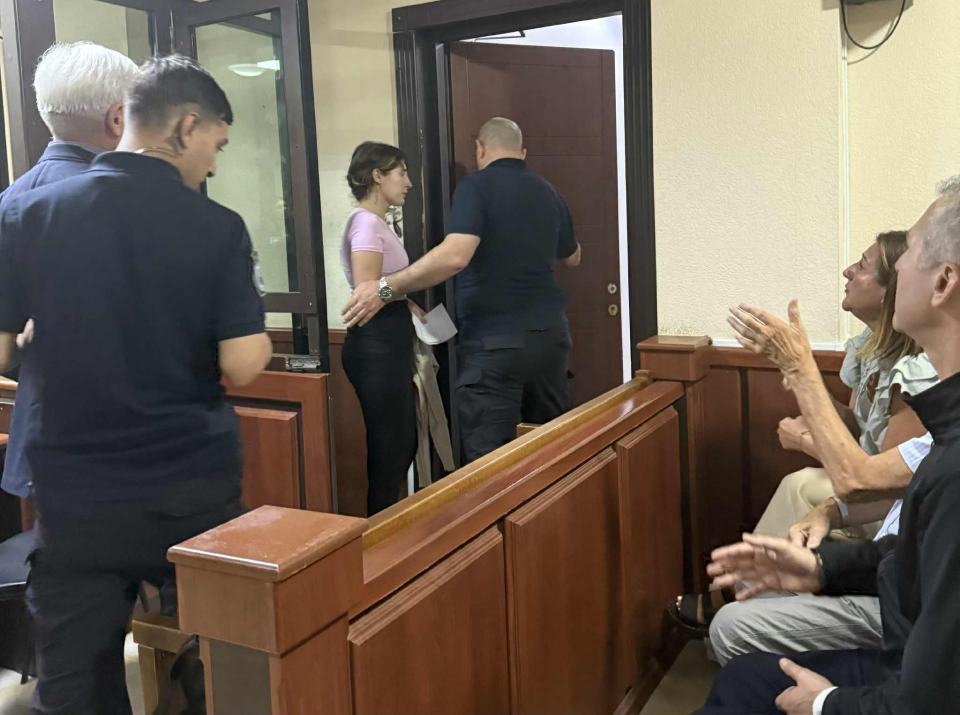 People in a courtroom.