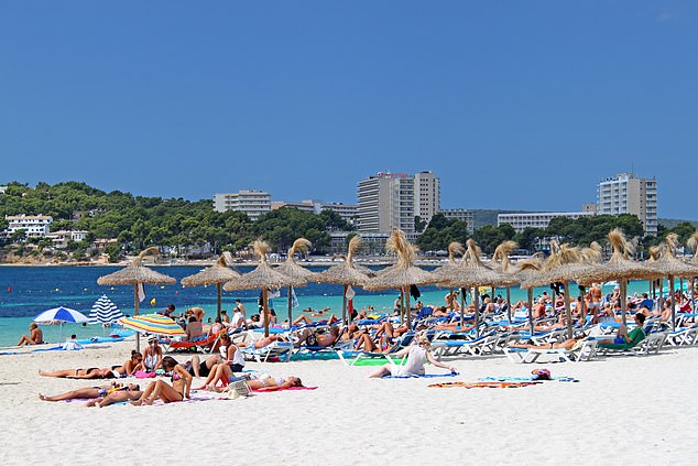 A British tourist was left seriously injured after falling off a boat and getting caught in its propeller near Nikki Beach in Magaluf. Pictured: File photo of sunbathers at Nikki Beach
