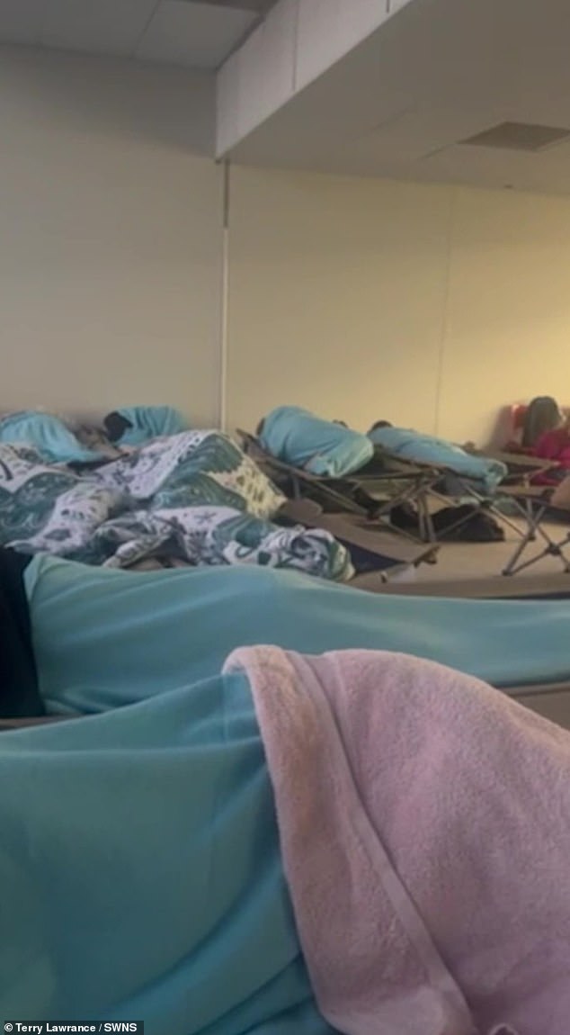 'It was like a warzone in a lounge - rows and rows of beds,' Terry said