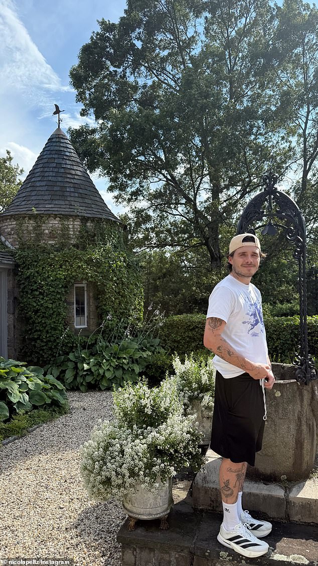 The 26-year-old sported a casual look for his Saturday outing, wearing black shorts and a white t-shirt as they enjoyed time away from the city in what looked to be the UK countryside