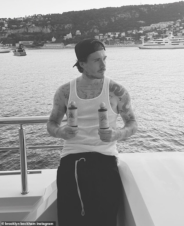 The eldest son of David and Victoria Beckham, 26, has been soaking up the sun in St Tropez with his wife Nicola, 30, amid their ongoing family feud