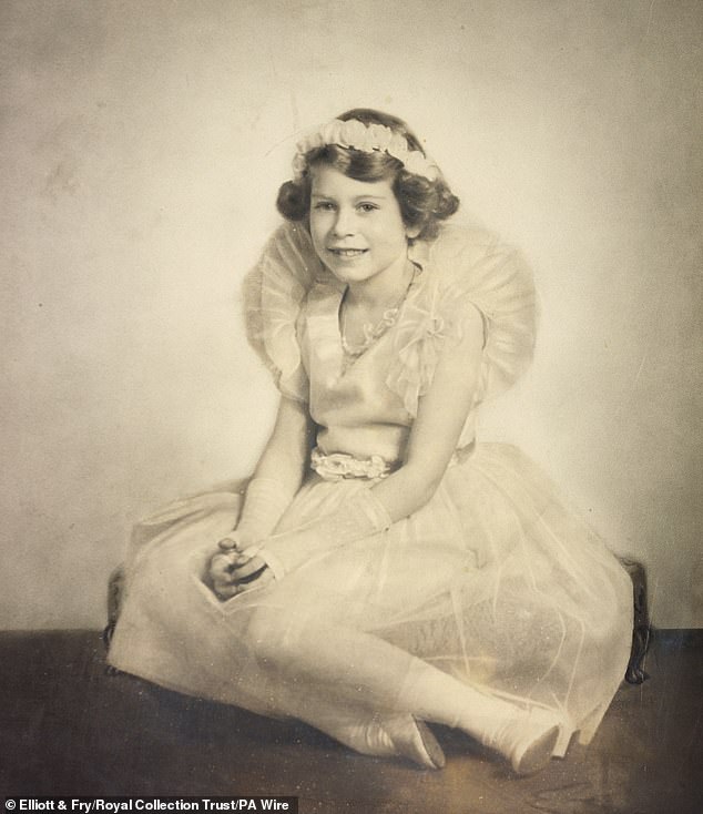 Princess Elizabeth of York as a bridesmaid at the wedding of the Duke and Duchess of Kent, November 29, 1934. The dress she wore is one of the items on display at the Queen Elizabeth II: Her Life in Style exhibition
