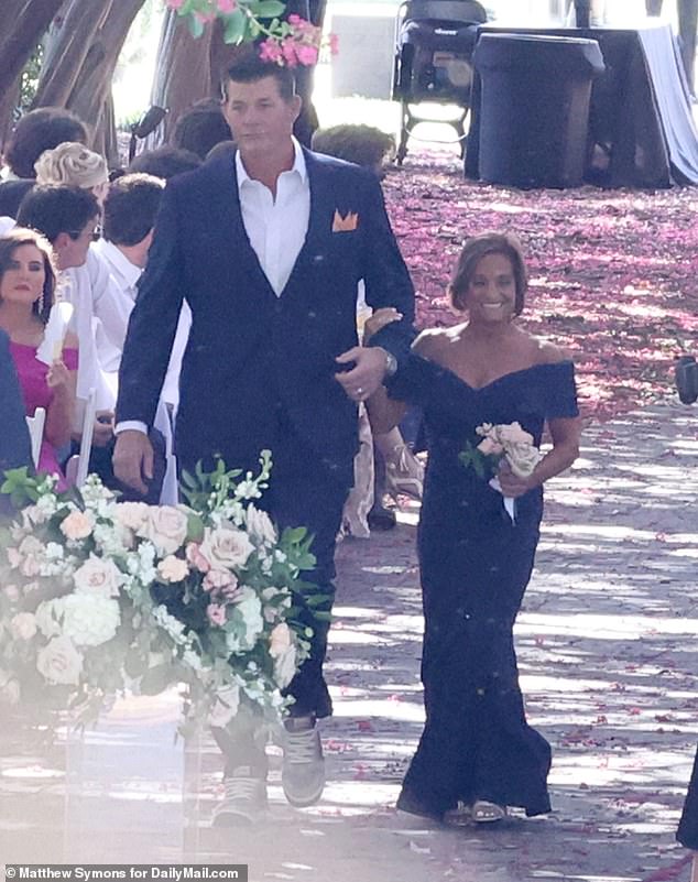 Tan and tiny Retton, 57, was dwarfed by her ex-husband, Shannon Kelley, a former University of Texas quarterback-turned-businessman, at her daughter's wedding on June 29