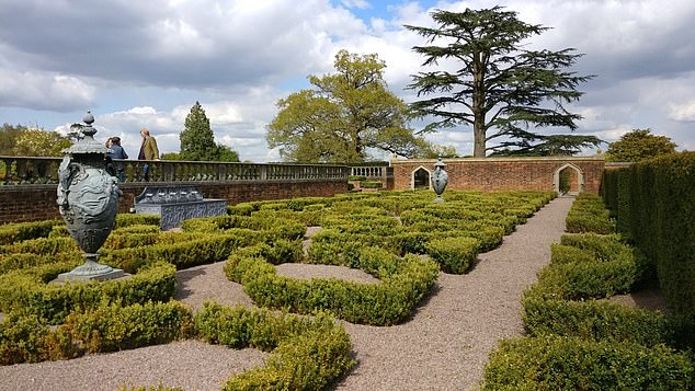 The detached home boasts a celebrated sunken gardens (pictured) with the grounds also containing an open amphitheatre, water features, orchards and two cottages for staff