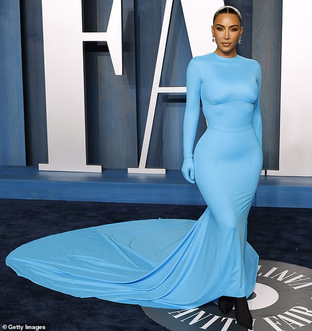 The past look had also consisted of a long train that flowed down behind Kim as well as matching gloves