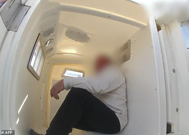 Sean Joseph Howland (pictured) is accused of assaulting a cabin crew member on a flight preparing for departure