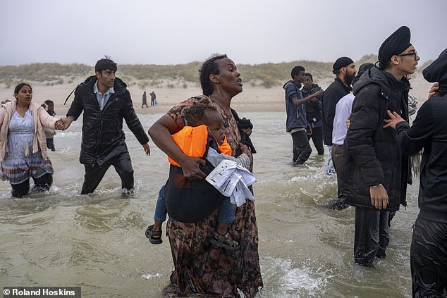 The panicked woman tried to dash through the choppy waters to reach the small boat