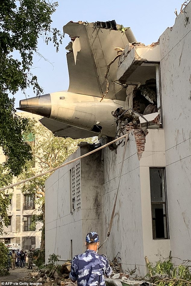 The tailend of Air India flight 171 is pictured after it crashed in a residential area near the airport in Ahmedabad on June 12, 2025