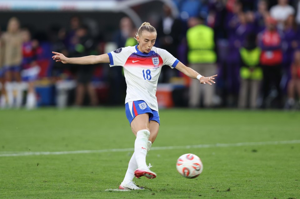 Chloe Kelly of England kicks a soccer ball during a penalty shootout.