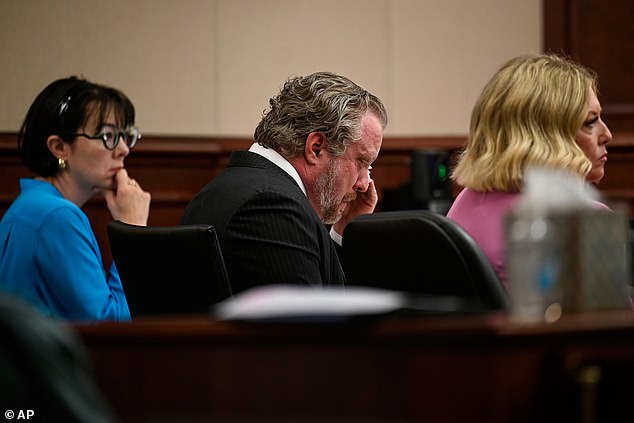 James Craig is seen wiping his tears while on trial for murdering his wife, Angela Craig