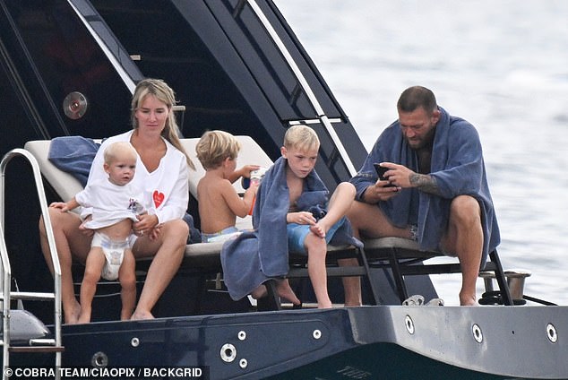 Conor McGregor was blissfully unware that his £2million Dublin pub was about to go up in flames, as he spent quality time with his fiancée Dee Devlin and their kids on a luxury yacht holiday in Sardinia, just hours before the incident