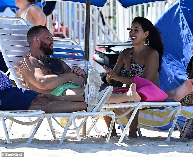 She was spotted laughing at something the MMA star had said