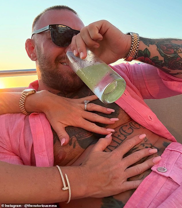 Conor McGregor's fiancee Dee Devlin couldn't keep her hands off him in a new social media snap of the duo on a yacht holiday