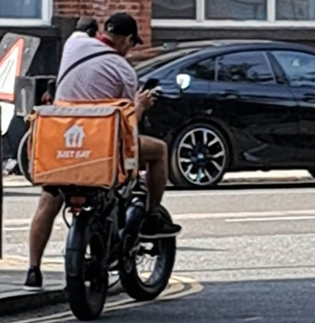 Shadow Home Secretary Chris Philp shared this photo of a rider outside an asylum hotel
