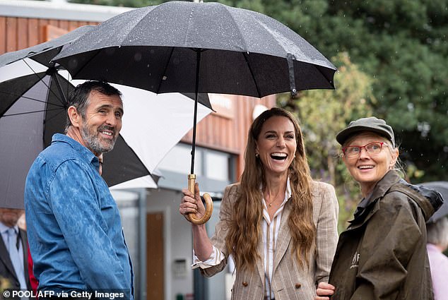 Catherine, Princess of Wales, laughs during a visit to the RHS Wellbeing Garden at Colchester Hospital in Essex on Wednesday July 2