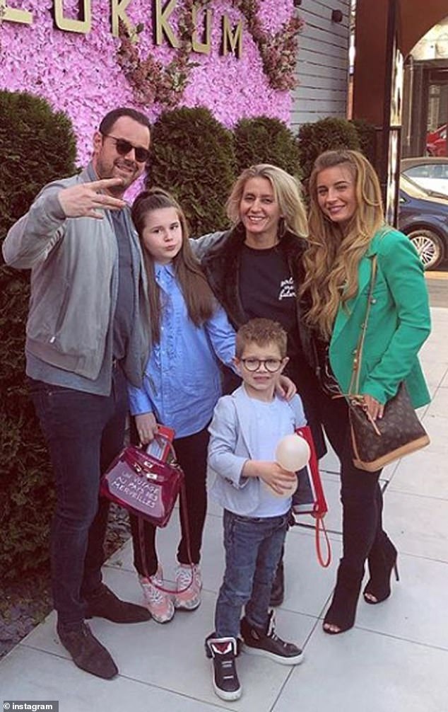 It comes after Danny said that despite being 'proudly working class' himself, his kids have never travelled on a bus and always go 'door to door' in a £200K Bentley (Pictured with wife Joanne Mas and daughters Dani, 28, Sunni, 18, and son Arty, 11)