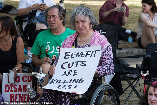 Disabled people and their supporters gather outside the Houses of Parliament for a protest against cuts to welfare benefits as MPs debated and voted on the government's Welfare Reform Bill at its second reading in London, United Kingdom on July 01, 2025