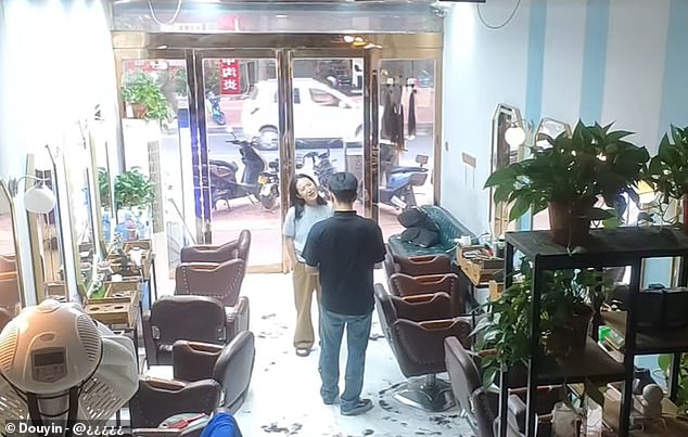 A Chinese woman went to her local salon to get a haircut, but asked to borrow some money from the owner when she realised she'd left her purse at home (Pictured: CCTV of the incident)