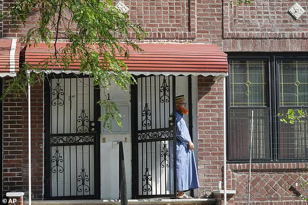 Islam's cousin Muhammad Mainul Islam was seen standing outside the slain NYPD officer's house in the Bronx on Tuesday