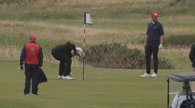 President Donald Trump could be seen picking up his ball on the green after a failed putt