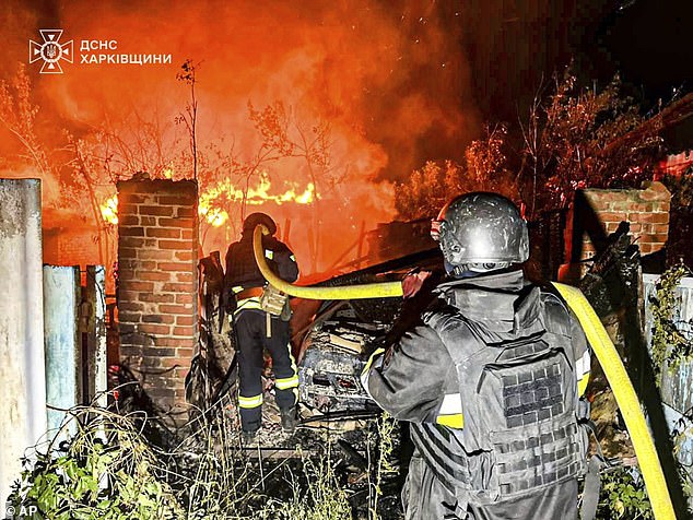 Donald Trump was today warned by Moscow that he is pushing Russia towards nuclear war with his new go-ahead for arms to Ukraine and the threat of punitive sanctions. Pictured: Firefighters try to put out a fire following a Russian attack in Kharkiv region, Ukraine, Tuesday, July 15, 2025