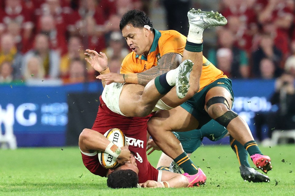 Rugby player tackle during a match.