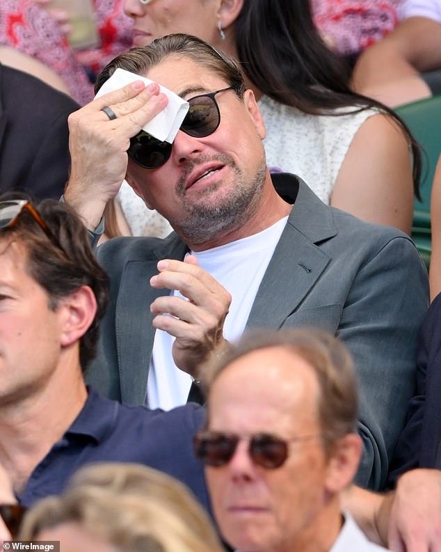 Leonardo DiCaprio was spotted mopping his brow while watching the men's singles semi-final at Wimbledon