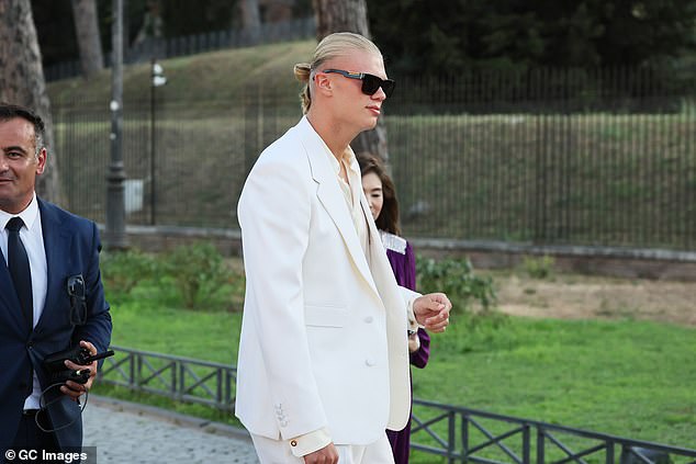 The Man City star, who has an endorsement deal with Dolce & Gabbana, was seen wearing a tailored white two-piece suit, along with a white shirt, sunglasses and loafers