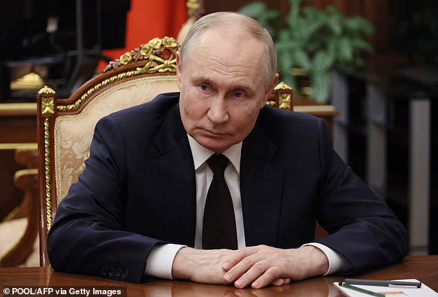 Vladimir Putin (pictured) has 'played' Donald Trump 'like a violin', a former MI6 chief warned