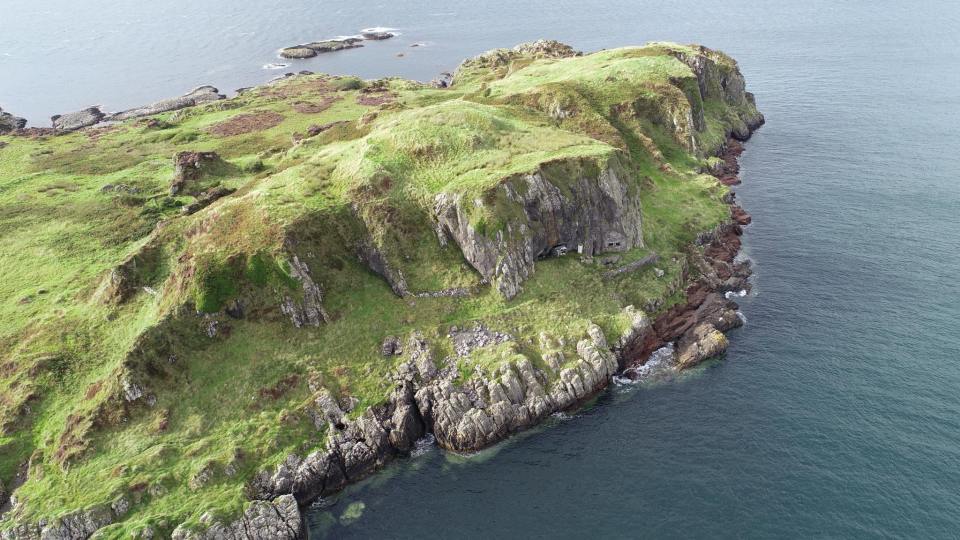 Aerial view of Insh Island, Scotland, showing a man-made cave in a rocky cliff.