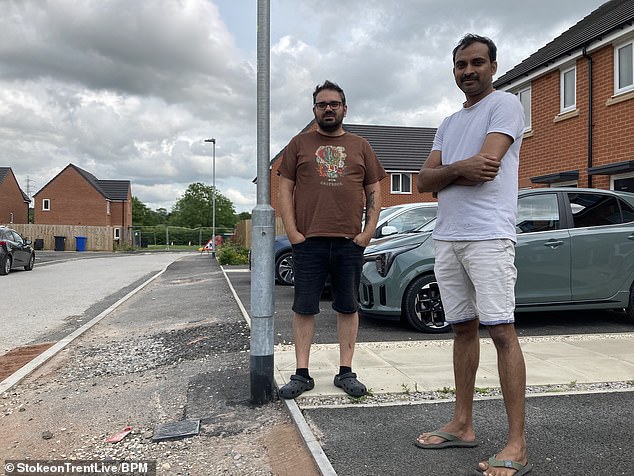 Bruno Nunes (left) and neighbour Don Jose are unhappy with developer Keepmoat as the roads and pavements outside their homes remain unfinished