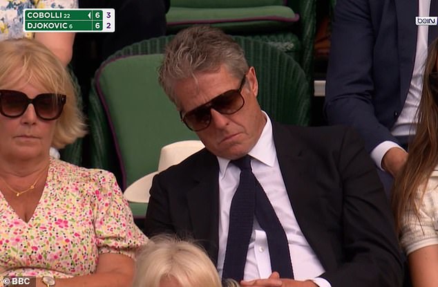 The excitement of the Wimbledon quarter-finals was too much for Hugh Grant , as he appeared to fall asleep while on camera in the Royal Box