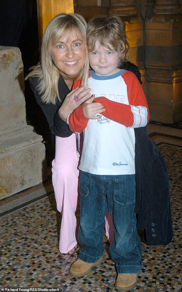 In Fiona's upcoming memoir, Martin shared how the broadcaster became 'terribly distressed' when she could not recognise their eldest son Nat (pictured with Nat in 2004)