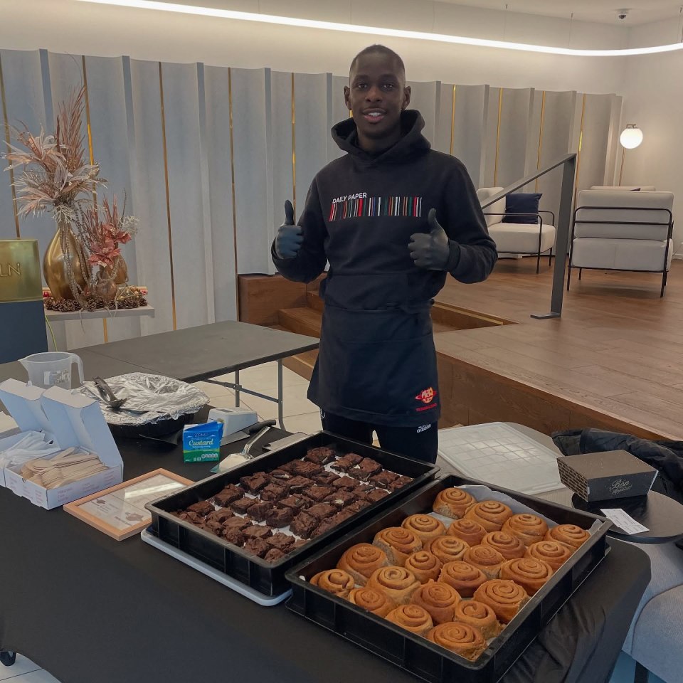 Person selling brownies and cinnamon rolls.