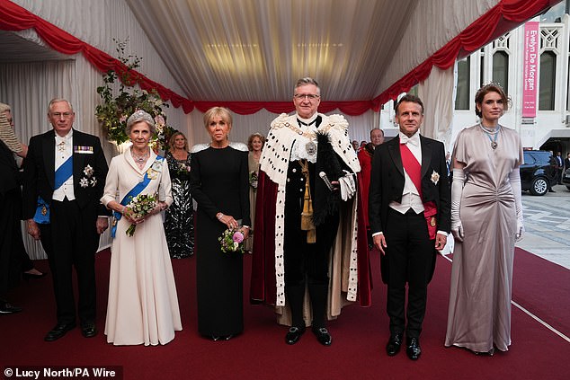 It was another festive feast for French President, who tonight attended a banquet hosted by Lord Mayor of the City of London, Alastair King. Pictured left to right: The Duke and Duchess of Gloucester, Brigitte Macron, Lord Mayor of the City of London Alastair King, President of France Emmanuel Macron and Lady Mayoress of the City of London Florence King
