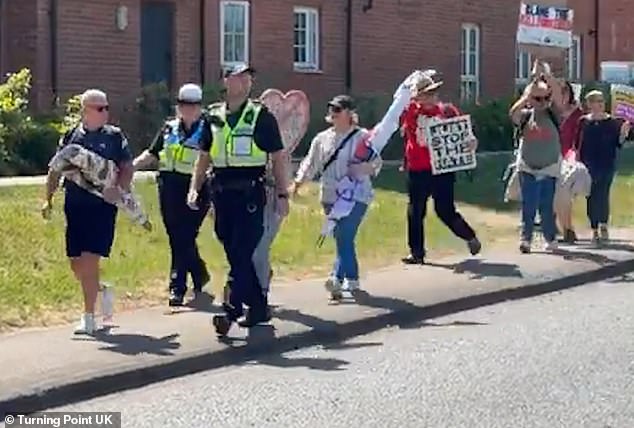 Hampshire police has come under fire after a video showed officers escorting pro-migrant counter-protesters to a protest outside an asylum seeker hotel in Aldershot