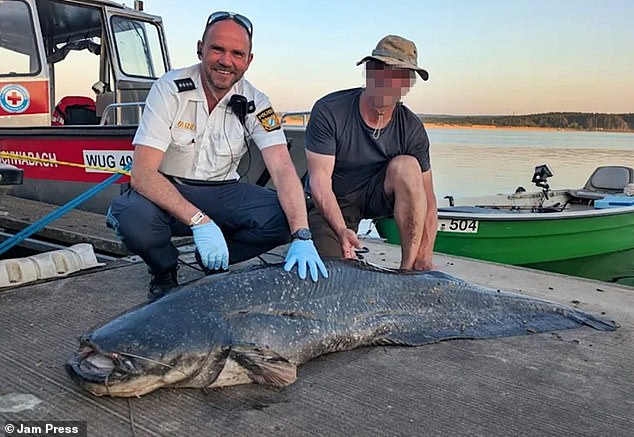 German police are facing furious backlash from animal rights groups after shooting a catfish in the head three times. The force issued a press release together with a photograph of the officers posing next to the body